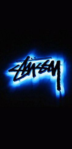 a neon sign that is lit up in the dark