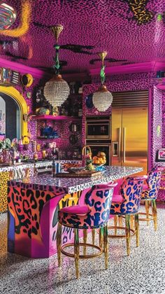 an elaborately decorated kitchen with bright colors and leopard print on the countertop, along with colorful stools