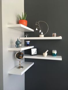 the shelves in the bathroom are white and black