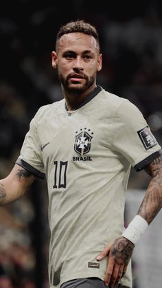 a soccer player with tattoos on his arm