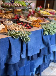 the table is covered with many different types of food