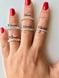 three different sizes of rings on someone's hand with the measurements for each ring