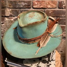 This Is A Pale Vintage Trail Ridge Hat That’s Been Dyed, Distressed, Burned And Etched. It Has A Buckskin Band With Lotus Flowers Etched On It’s Surface. There Is Another Lotus Flower Heat Etched Onto The Crown. The Size Is 6 7/8 Which Is 21 1/2-5/8” And Considered A Small. Photos Taken In Cool Morning Light And Indoor Light. Vintage Trail, Felt Hats, Festival Hat, Clothing Outfits, Lotus Flowers, Felt Hat, Custom Hats, Hat Sizes, Lotus Flower