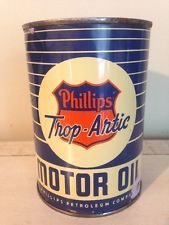 an old phillips motor oil can sitting on a table