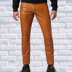 A high-quality genuine leather pant is a must in every men wardrobe. You can find real leather jackets for men at Leather Rend at very affordable prices. If you feel a little creative or know exactly what you want, you can even design your own leather pants online @Leather trend , we are all about customization any design of your choice also . We want you to feel at the top of the world whenever you are wearing one of our appealing and stylish leather Pants for men. FEATURES *OUTSIDE MATERIALS: 100% Lambskin Genuine Leather. *INSIDE MATERIALS: Premium Satin linings. *HARDWARE: Hand Polished Metal hardware. FEATURES 1.DO NOT WASH AND TUMBLE DRY OR DRY CLEAN. 2.DO NOT IRON. 3.CLEAN IN PROFESSIONAL LEATHER CARE CENTRE. Biker Leather Pants With Standard Cut Leg, Brown Leather Trousers For Winter, Casual Fitted Leather Pants, Leather Straight Leg Bottoms For Winter, Brown Leather Straight Leg Pants, Brown Leather Pants With Straight Leg, Casual Leather Pants With Standard Cut Leg, Casual Leather Pants With Standard Cut, Fitted Brown Leather Bottoms