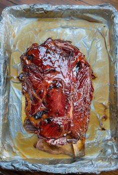 a piece of meat sitting on top of tin foil