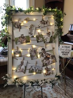 an old photo frame is decorated with lights and garlands to hang on the wall