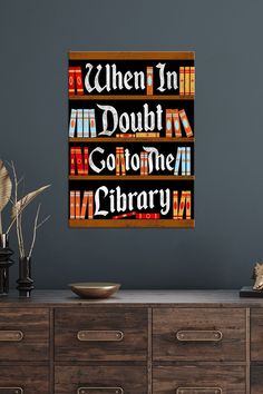 there is a book shelf with books on it and the words when in doubt go to the library