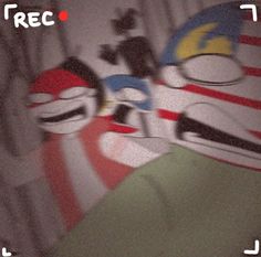 two masks are sitting on top of each other in front of a wall with the word rec