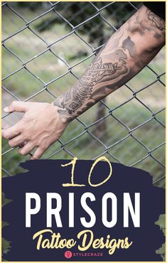 a man with tattoos on his arm is holding the hand of another person behind a fence