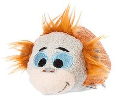 a close up of a stuffed animal with hair on it's head and eyes