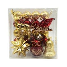 assorted christmas ornaments in plastic package on white background