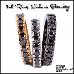 three black and gold rings with diamonds on each side, all in different shapes and sizes