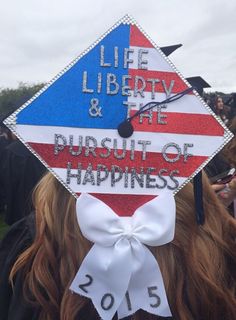 a graduate's cap with the words life liberty and the pursuit of happiness on it