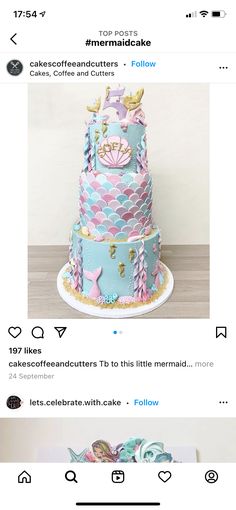 the cake is decorated with pink and blue icing, mermaid decorations, and seashells