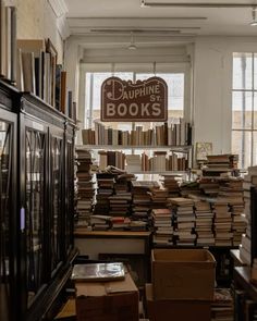 a room filled with lots of books and boxes