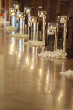 rows of candles lined up on the floor