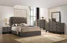 a bedroom scene with focus on the bed and dresser