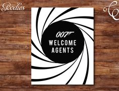 a black and white poster with the words welcome agent on it, in front of a wooden