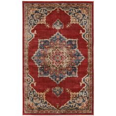 a red and blue rug with an ornate design on the center, in front of a white background