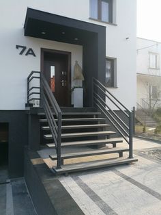 an entrance to a building with stairs leading up to it