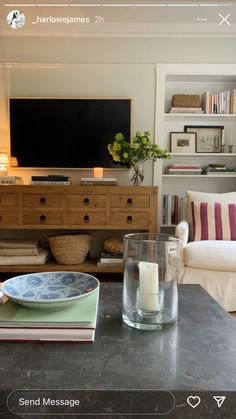 a living room filled with furniture and a flat screen tv