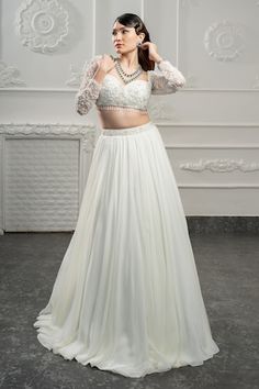 Ivory attached cancan lehenga beads and sequin embroidered waistband. Paired with an embroidered padded blouse and dupatta. - Aza Fashions Fitted White Hand Embellished Sets, White Hand Embellished Fitted Sets, White Fitted Hand Embellished Sets, Fitted Hand-embellished White Sets, White Hand Embellished Choli For Reception, White Hand Embellished Organza Sharara, White Hand-embellished Organza Sharara, Fitted White Hand Embellished Choli, Hand Embellished White Organza Sharara