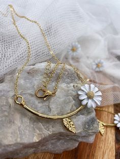 Try on our daisy flower necklace in gold color! It will be a wonderful match with your summer dress! Match with Daisy Adjustable Ring: https://www.etsy.com/listing/1207959575/daisy-flower-statement-adjustable-ring And with Daisy Cuff Bracelet: https://www.etsy.com/listing/1208338723/bee-yourself-daisy-cuff-bracelet Daisy Stud Earrings: https://www.etsy.com/listing/1194472706/daisy-flowers-stud-earrings Daisy flower meaning includes new beginnings, hope, innocence, fun, affection, and other sweet attributes! All what you need this time! Length: 18 inch Daisy Flower: 1/2 inch; Materials: Zinc Alloy; Gold Plated. - Avoid applying lotions or perfume once your jewelry are on. - Store necklace separately in fabric bags or box. We want you to love this product as much as we do. If you have any qu Daisy Studs, Flower Meanings, Daisy Flowers, Wedding Jewellery Necklace, Pearl Wedding, Pearl Flower, Fabric Bags, Flower Necklace, Adjustable Ring