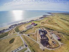 an aerial view of the beach and ocean with construction in progress on the land next to it