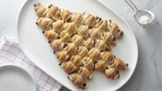 a white plate topped with pastries on top of a table