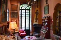 a living room filled with furniture and a chandelier