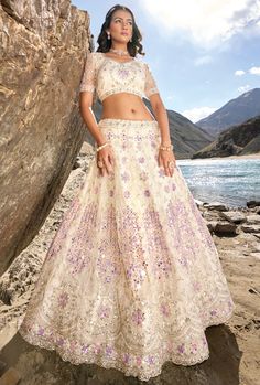 Crafted from luxurious pure net, pure organza, and pure georgette fabric, this Lehenga Choli is the epitome of elegance. With its lightweight and airy material, it offers a comfortable fit and a flattering silhouette. Perfect for special occasions, this lehenga choli will make you stand out in style. LEHENGA FABRIC: Pure Net, Pure Organza, Pure Georgette BLOUSE FABRIC: Pure Net, Pure Organza, Pure Georgette DUPATTA: Pure Net SIZING: Can be stitched upto 42 inches bust and waist SHIPPING: The pro Blue Bridal Lehenga, White Lehenga Choli, Blouse Lehenga, Designer Bridal Lehenga Choli, White Lehenga, Designer Bridal Lehenga, Net Lehenga, Choli Designs, Lehenga Choli Online