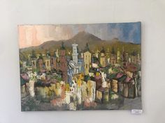 an oil painting of a cityscape with mountains in the background