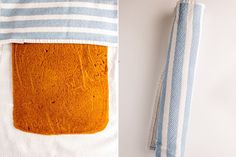 a piece of bread sitting on top of a towel next to a blue and white striped napkin