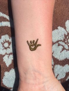 a person with a small tattoo on their wrist