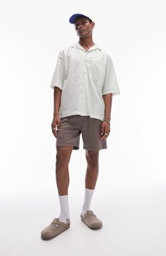 Roomy and relaxed, this camp shirt cut from lightweight cotton sports pale pinstripes and a casual, wear-everywhere vibe. 29" length; 46" chest (size Medium) Front button closure Notched collar Elbow-length sleeves Chest patch pocket 100% cotton Machine wash, line dry Imported Elbow Length Sleeve, Fabric Gift Bags, Camping Shirt, Cut Shirts, Nordstrom Store, Free Fabric, Anniversary Sale, Fabric Gifts, Patch Pocket