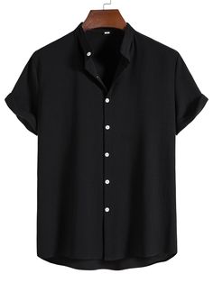 a black shirt with buttons on the front and collar, hanging from a wooden hanger