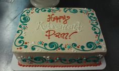 a cake that is sitting on top of a white plate with the words happy retirement pam written on it