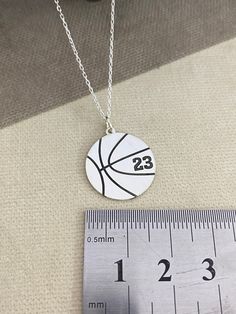 "Basketball Necklace Personalized, Custom Basketball Necklace, Basketball Coach Gift, Basketball Player Jewelry, Basketball Number Pendant Special to sports teams. if you need 10pcs necklaces, 2 necklaces are gift from us. * All of our jewelry is handmade and original materials are used. It does not cause any skin problems. No Tarnish problems. *Custom Basketball Necklace will be handmade with your desired name.You can have your own name personalized on this necklace. * Material: High Quality 92 White Team Spirit Jewelry For Gifts, White Team Spirit Jewelry As A Gift, White Team Spirit Jewelry Gift, Basketball Things, Basketball Jewelry, Basketball Necklace, Basketball Coach Gifts, Year Necklace, Number Jewelry