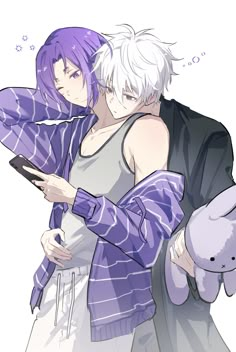 two people are hugging each other with purple hair