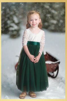 Hunter Green Flower Girl Dress Discover the enchantment with our ethereal Forest-Inspired Flower Girl Dress in Hunter Green. This long sleeve, full-length piece perfectly captures the magic of any season. With its rich hues echoing the evergreens, your little one will shine at any special occasion. The dress is perfect for a wedding for your flower girl, a party, birthday party family photos or any other special event. Dress Features A soft white bodice, made of stretchy lace with a "V" shaped o Green Flower Girl Dress, Green Christmas Dress, Green Holiday Dress, Ethereal Forest, Green Flower Girl Dresses, Hunter Green Dresses, Long Flower Girl Dresses, Lace Back Dresses, Layered Tulle Skirt