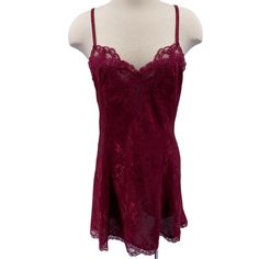 Features: * Vintage slip dress/chemise * Tags have been removed, but I believe it's approximately a medium * Maroon with floral jaquard print * Lace trim * Adjustable straps * Chemise * Floral * Made in Unknown * Machine wash * Gently used condition Size: Womens M Measurements: Across Bust: 17 in / 43 cm Across Waist: 15.5 in / 39 cm Across Hips: 18.5 in / 47 cm Length: does not include strap length 29.5 in / 75 cm Condition: Pre-Owned Good Tags have been removed. I would say it's approximately a medium Fitted Lace V-neck Chemise, Lace Cami Dress With Built-in Bra, Sleeveless Lace Chemise For Party, Lace Camisole Slip Dress For Night, Lace Coquette Chemise For Night, Lace Chemise With Spaghetti Straps For Night, Night Lace Chemise With Spaghetti Straps, Fitted Lace Chemise For Night, Lace Cami Slip Dress For Night