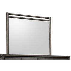 a large mirror sitting on top of a wooden shelf next to a wall mounted cabinet