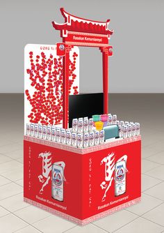 a red and white display case filled with bottled water