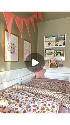 a bed room with a neatly made bed and pictures on the wall