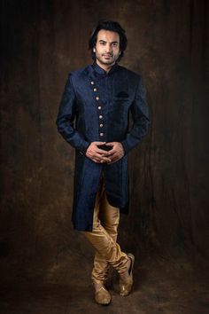 Dark Blue Indo Western Sherwani In Self Weaved Rayon Jacquard With a Blend of Black And Fine Velvet Detailing Paired With Gold Chudidar * Self Weaved Rayon Jacquard Self Weaved Dark Blue & Black Blend Indo Western Sherwani * Matching Fabric Buttons * With Velvet detailing * Colour - Dark Blue & Black Blend * Paired With Gold Chudidar In Silk We Will Do Custom Stitching as per our body measurements Just Like You visit a tailor for stitching We Will Take Your Body Measurements In whtsapp/Telegram/FB/Zoom Video call Thank You for Visiting Fitted Traditional Wear With Resham Embroidery For Groom, Traditional Fitted Sherwani For Groom, Fitted Sherwani For Groom, Diwali Festival, Fitted Sherwani For Groom Diwali Celebration, Fitted Long Bandhgala For Groom, Fitted Long Sherwani For Groom, Fitted Long Sleeve Traditional Wear For Groom, Fitted Sherwani With Dabka For Groom, Long Traditional Wear For Groom On Eid