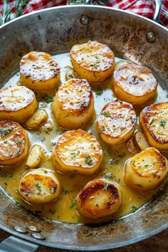 a pan filled with potatoes covered in gravy