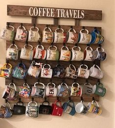 coffee mugs are hanging on a wooden rack