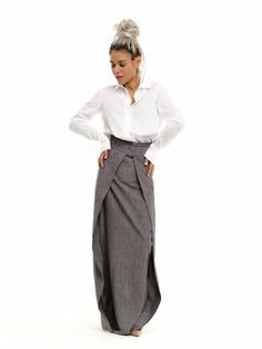 "Subvert expectations in our unique maxi skirt. The high-waisted design defines your waist while the diagonal layered fabric elongates your body. FEATURES: A floor-length pinstripe maxi skirt. High-waisted design with a zipper at the back. Please note that this piece does not have pockets. 100% Handmade. SIZE & FIT: Fit: A relaxed fit with room to move The model is wearing size Small or S/M View our SIZE CHART before ordering MATERIALS & CARE: Content: Linen Care: Machine wash on cold (30ºC) wit Maxi Skirt Outfit, Long Linen Skirt, Linen Layers, Classic White Shirt, High Waisted Maxi Skirt, Maxi Skirt Outfits, Rock Outfit, Locker Room, Skirt Outfit