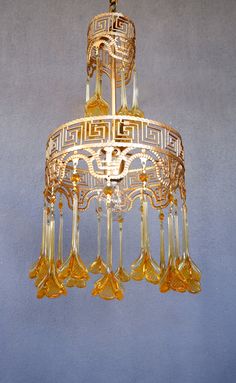 a gold chandelier hanging from the ceiling